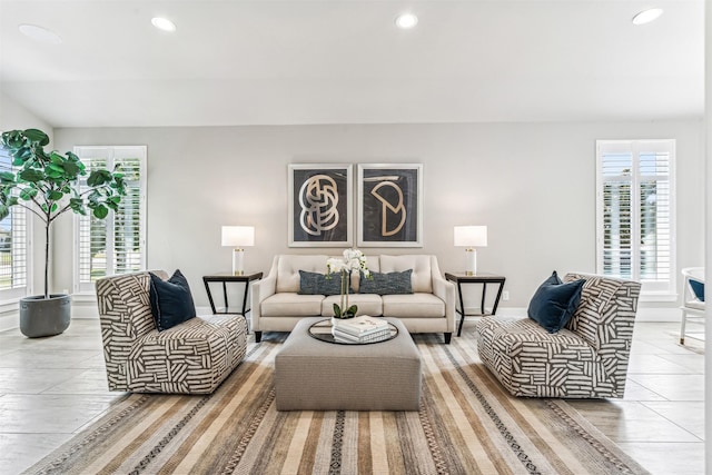 living area with baseboards, recessed lighting, and plenty of natural light