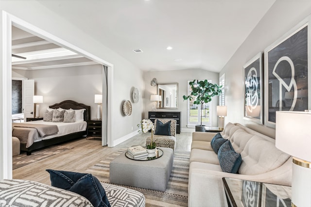 bedroom featuring lofted ceiling and light hardwood / wood-style floors