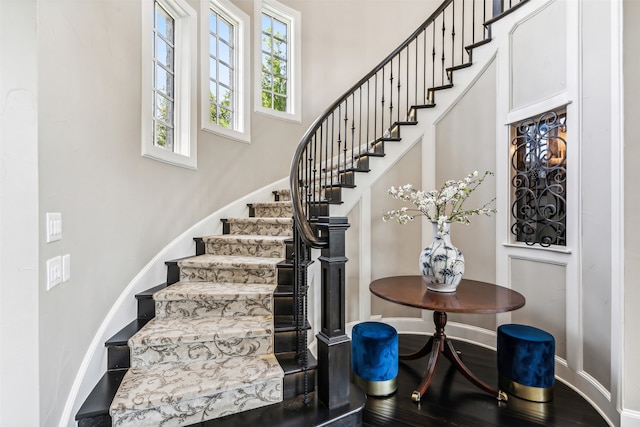 stairs with hardwood / wood-style floors