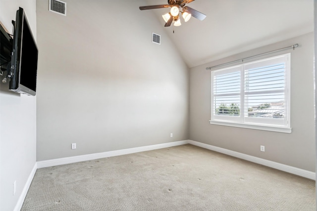 unfurnished room with visible vents, light carpet, a ceiling fan, and lofted ceiling