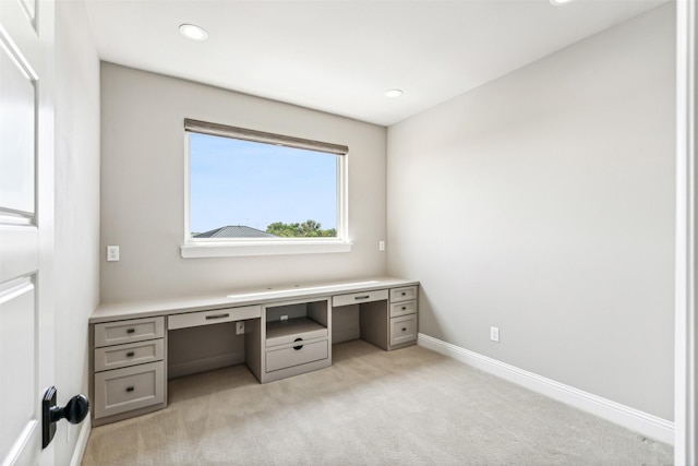 unfurnished office with light colored carpet, recessed lighting, and baseboards