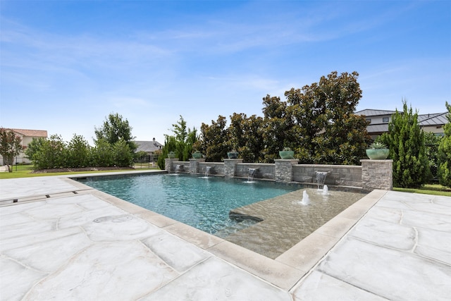 view of swimming pool with a patio area and pool water feature