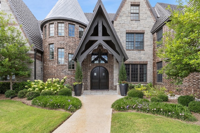 view of front of house featuring brick siding