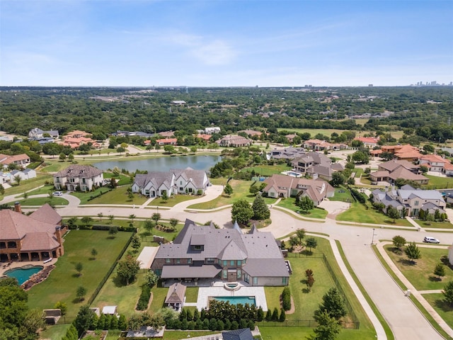aerial view with a residential view and a water view