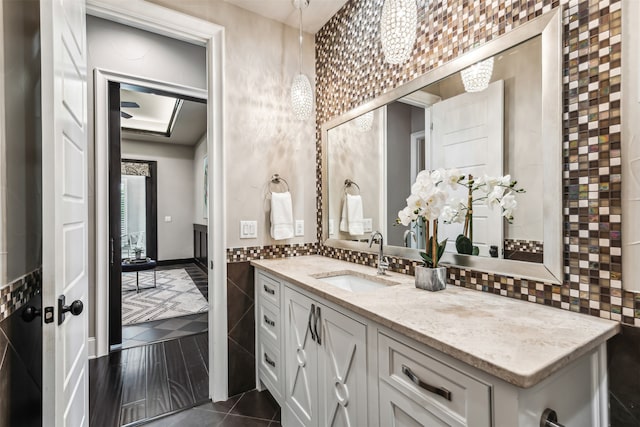 bathroom with vanity, backsplash, and tile patterned floors