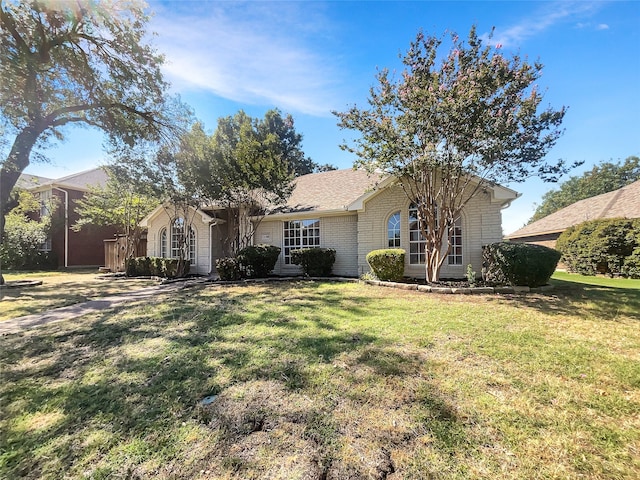 ranch-style home with a front yard