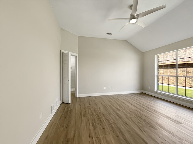 unfurnished room with vaulted ceiling, wood-type flooring, and ceiling fan