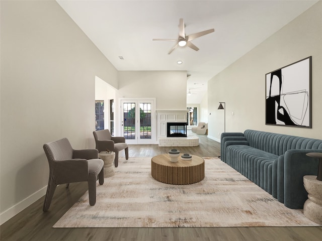 living room with ceiling fan and hardwood / wood-style floors