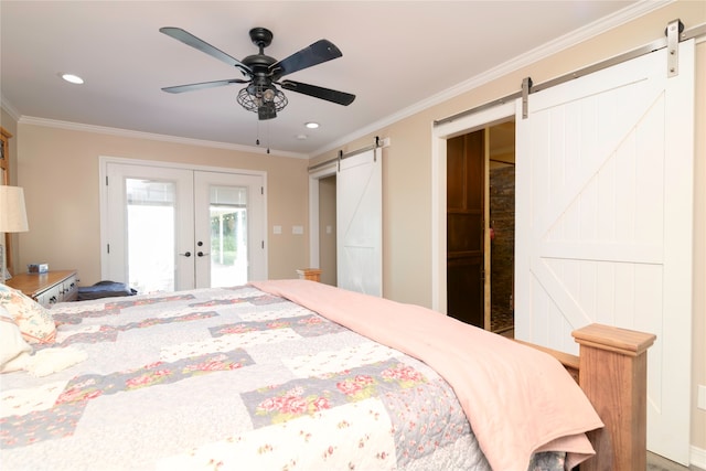 bedroom featuring a barn door, ceiling fan, and ornamental molding