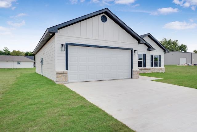 view of front of house with a garage and a front lawn