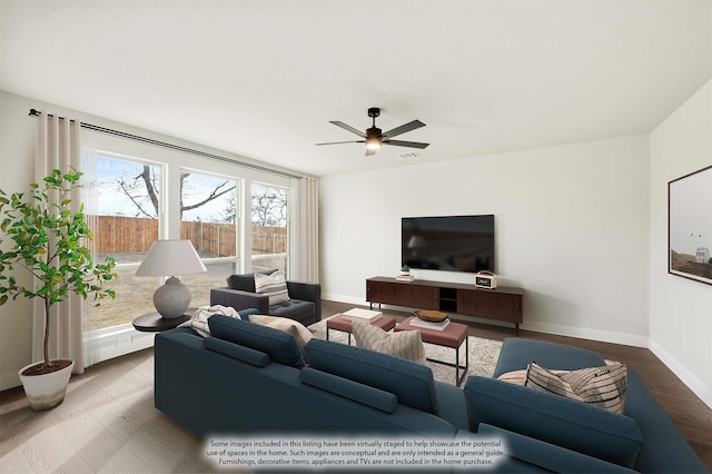 living room with hardwood / wood-style flooring and ceiling fan