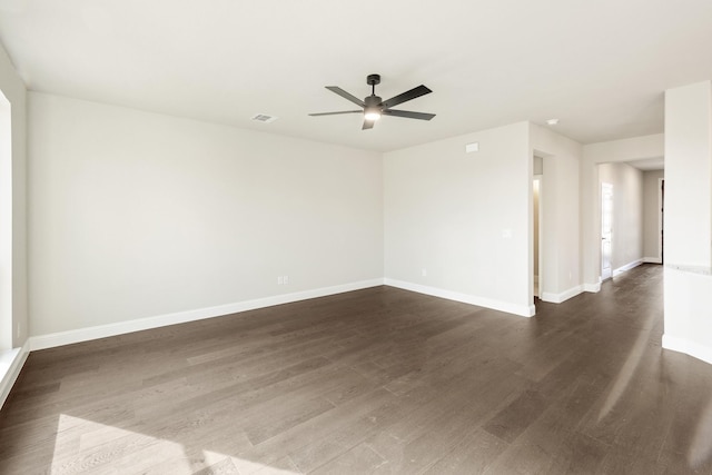 unfurnished room with ceiling fan and dark hardwood / wood-style floors