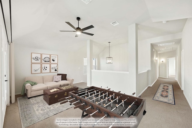 carpeted living room featuring ceiling fan and lofted ceiling