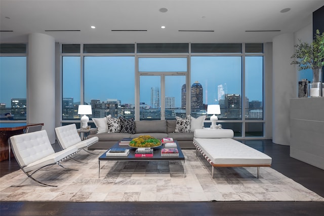 living room featuring a wall of windows and wood-type flooring