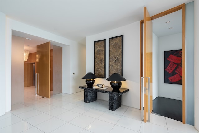 tiled living room with floor to ceiling windows