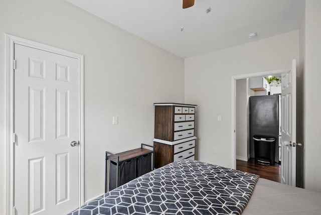 bedroom featuring dark wood-type flooring and ceiling fan