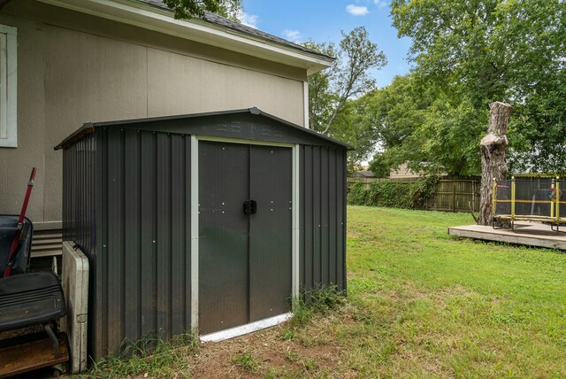 view of outbuilding with a yard