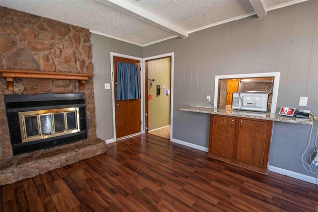 entryway with french doors, beamed ceiling, dark hardwood / wood-style floors, and a textured ceiling