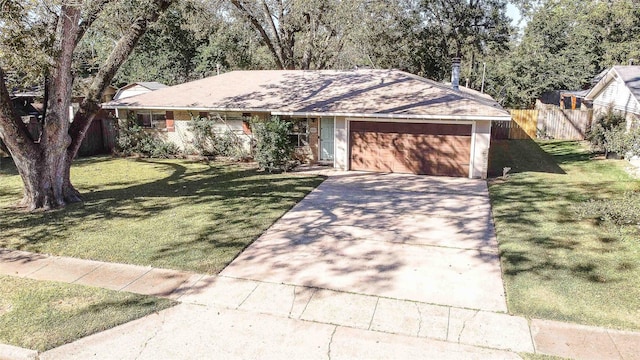 ranch-style home with a front yard and a garage