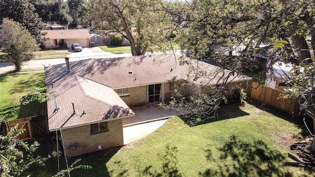 ranch-style house with a front yard and a garage