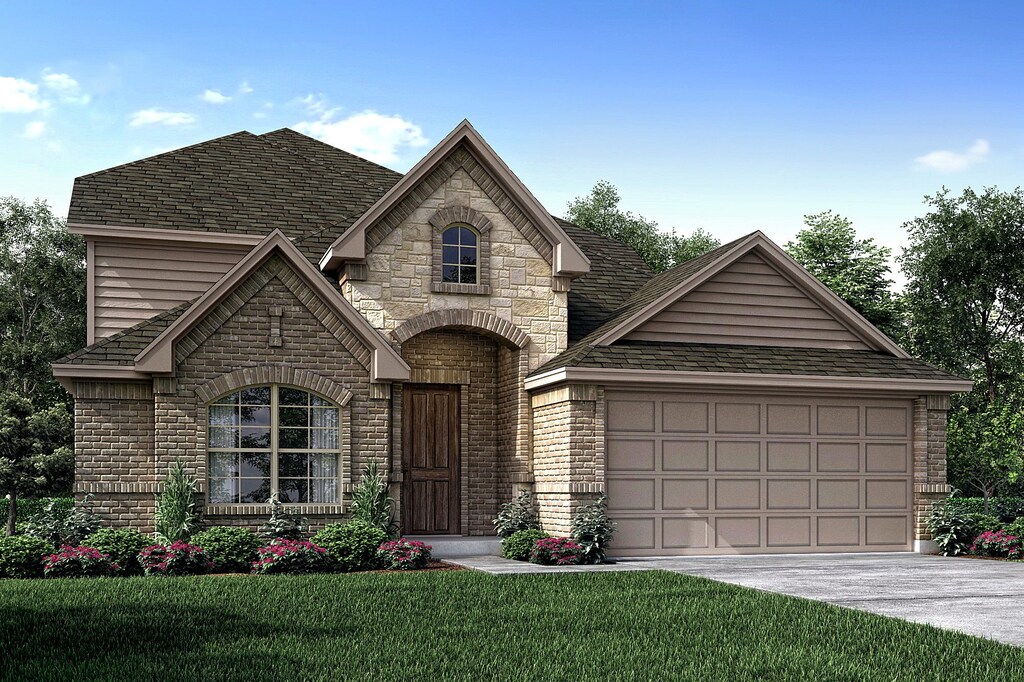 french country style house with a garage and a front yard