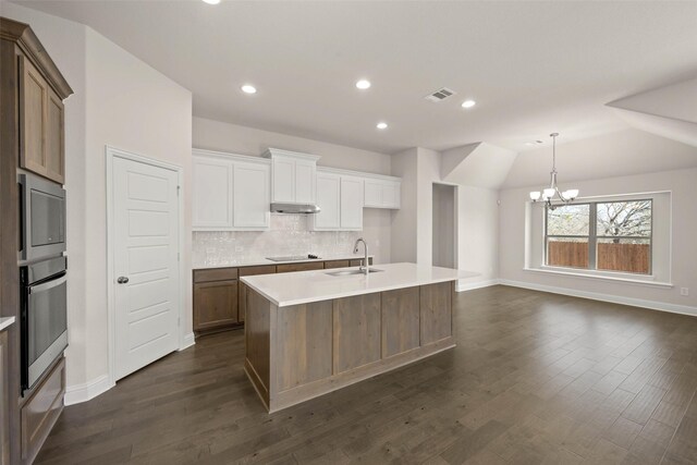 stairway featuring a high ceiling, wood finished floors, and baseboards