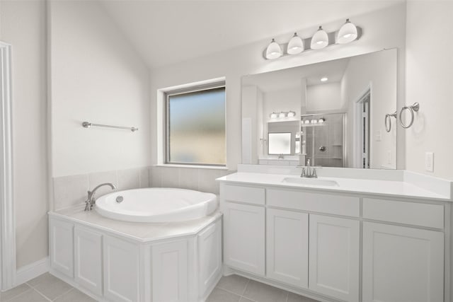 full bathroom with tile patterned flooring, a stall shower, vanity, and a garden tub