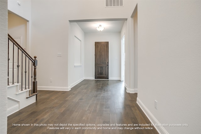 entryway with dark hardwood / wood-style floors