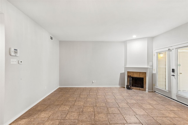 unfurnished living room featuring a fireplace