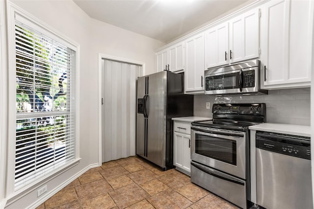 kitchen featuring white cabinetry and appliances with stainless steel finishes