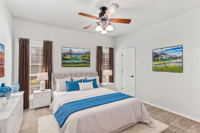 carpeted bedroom featuring ceiling fan