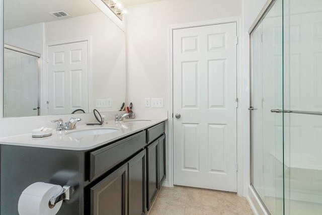 bathroom with vanity and walk in shower