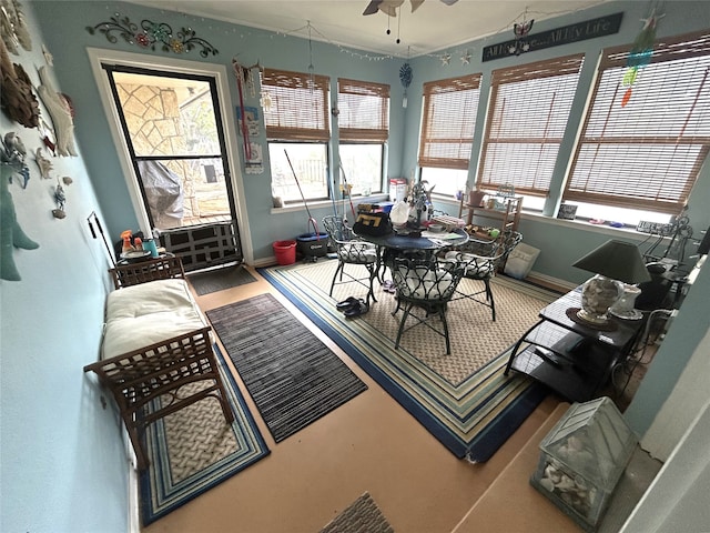 sunroom / solarium with ceiling fan