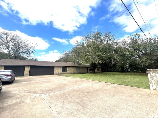 view of front of home with a garage and a front yard