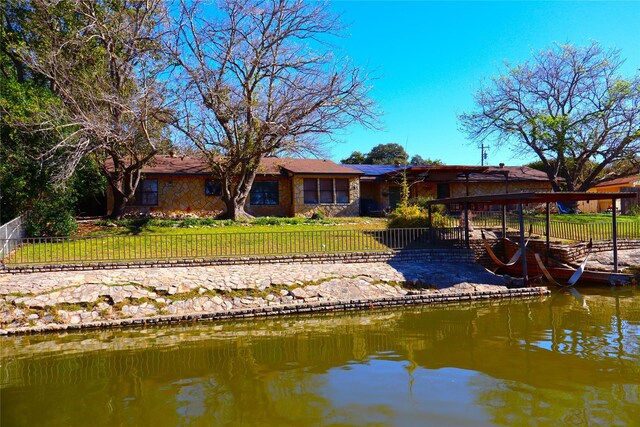 rear view of property featuring a water view