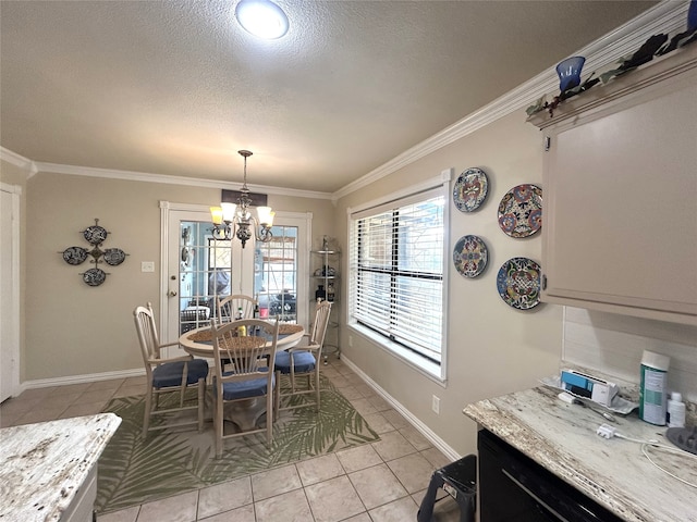 tiled dining room with crown molding, a textured ceiling, and an inviting chandelier