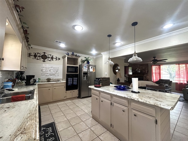 kitchen with ceiling fan, crown molding, sink, black appliances, and a kitchen island