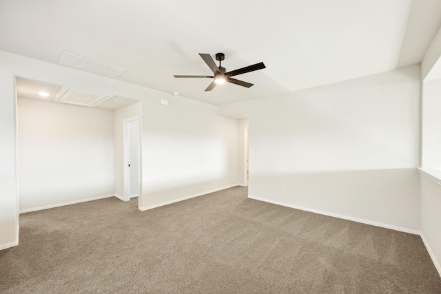 carpeted spare room featuring ceiling fan