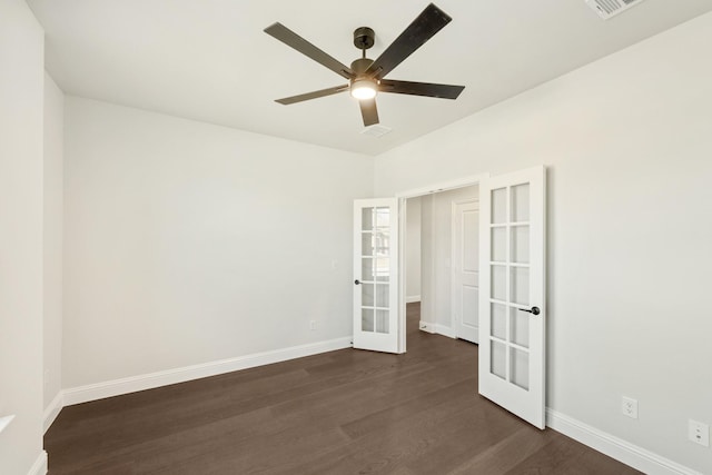 empty room featuring dark hardwood / wood-style flooring, ceiling fan, and french doors