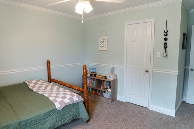 carpeted bedroom with ceiling fan and ornamental molding