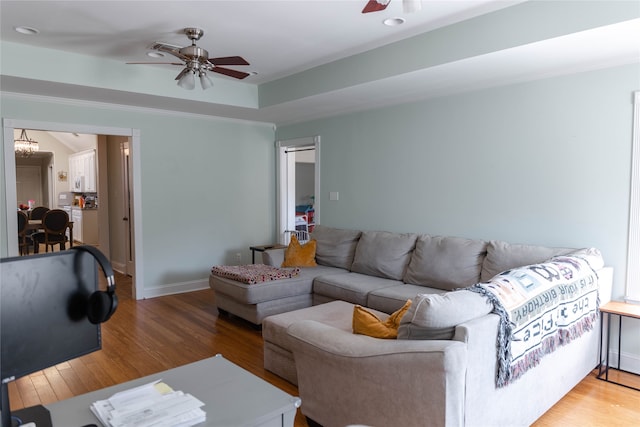 living room with ceiling fan and hardwood / wood-style flooring