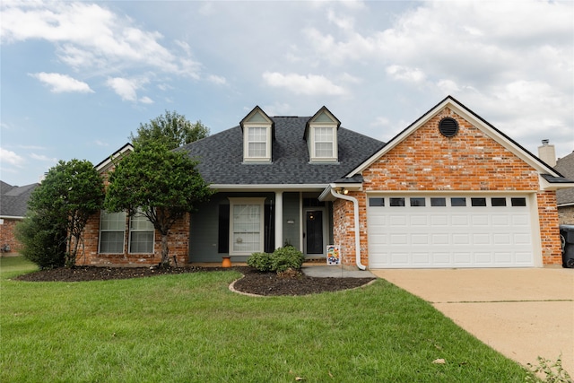 view of front facade featuring a front yard and a garage