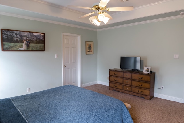 bedroom featuring ceiling fan, crown molding, and dark colored carpet