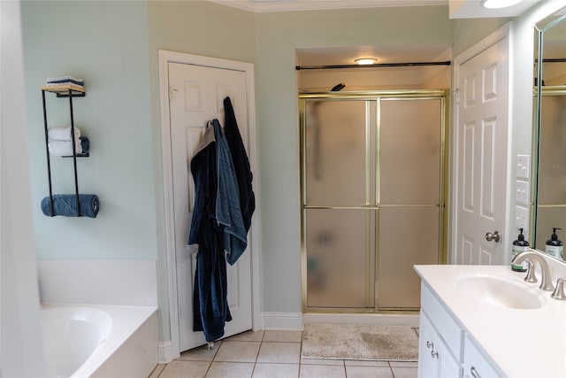 bathroom with plus walk in shower, tile patterned floors, and vanity