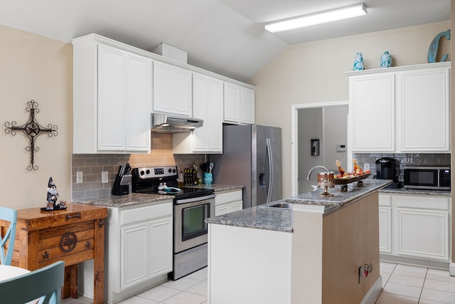 kitchen with sink, stone counters, white cabinetry, stainless steel appliances, and range hood