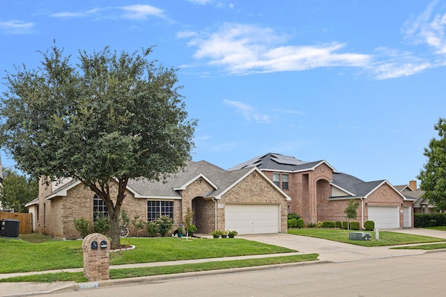 view of front facade featuring a garage, central air condition unit, and a front lawn