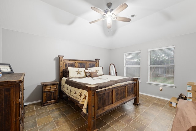 bedroom featuring vaulted ceiling and ceiling fan