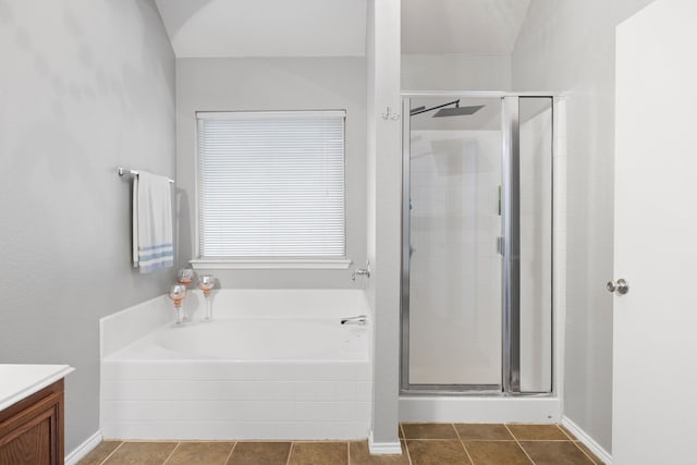 bathroom with shower with separate bathtub, tile patterned flooring, and vanity