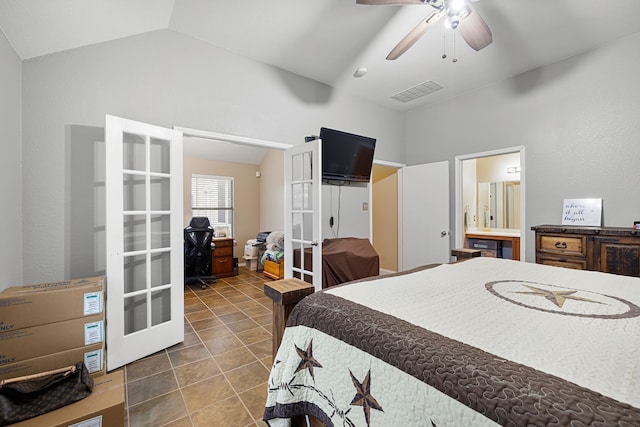 tiled bedroom with ceiling fan, ensuite bath, and vaulted ceiling