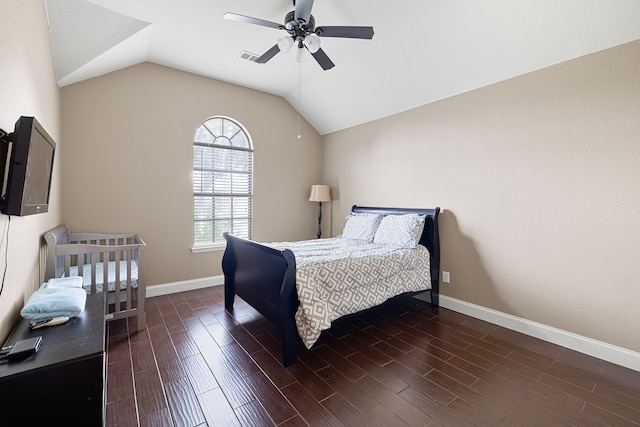 bedroom featuring ceiling fan, lofted ceiling, and dark wood-type flooring